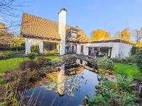Exklusive Immobilie Einfamilienhaus Wunderschönes Architektenhaus mit traumhaftem Garten in ruhigem Privatweg - Oberneuland